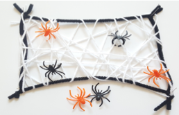 Plastic ring spiders in web for four fun Halloween STEM Activities